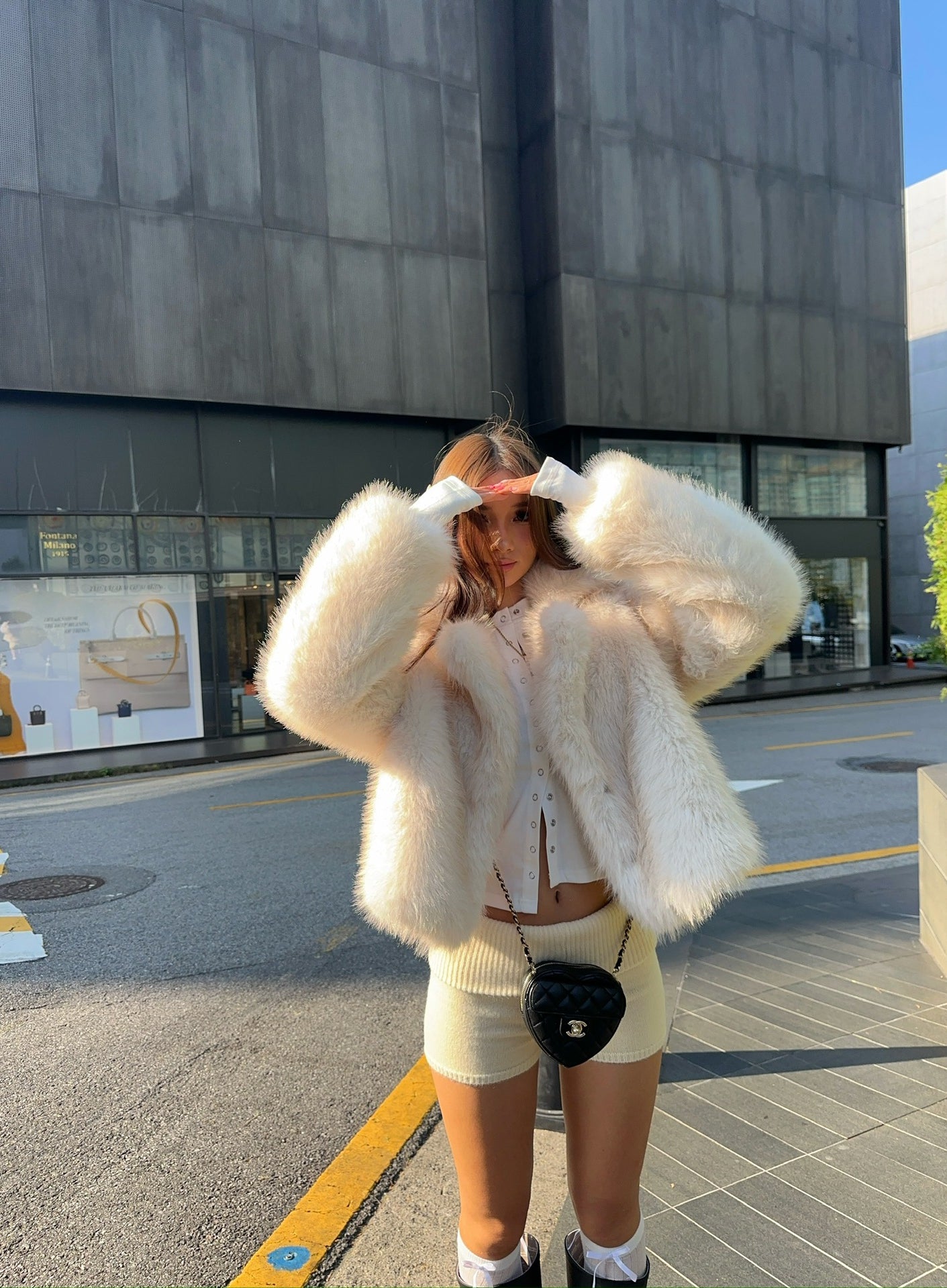 Cream fluffy faux fur jacket with cropped fit and oversized sleeves