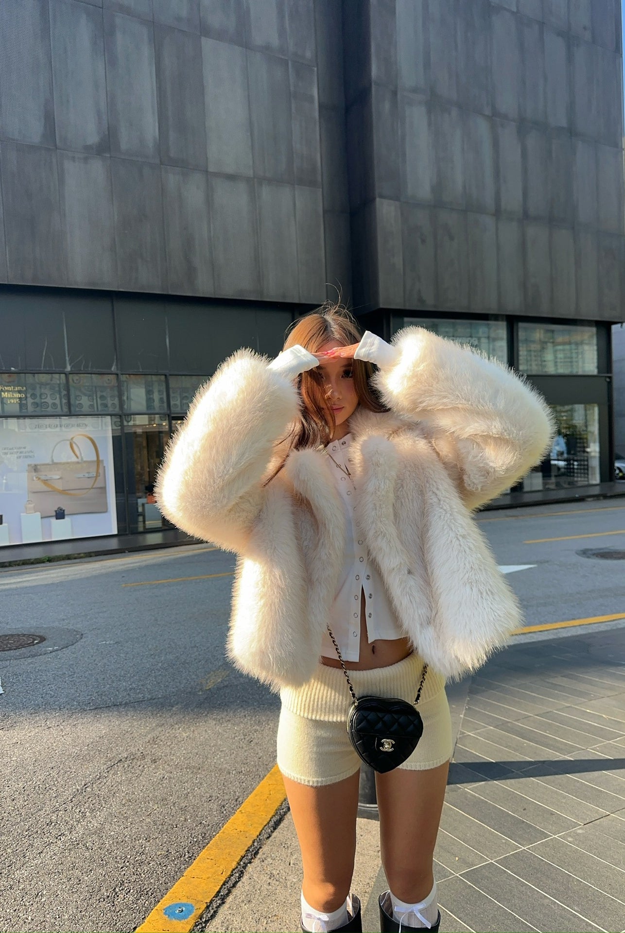 Cream fluffy faux fur jacket with cropped fit and oversized sleeves