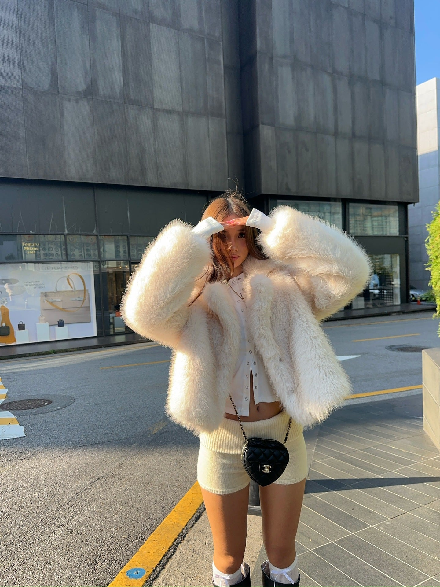 Cream fluffy faux fur jacket with cropped fit and oversized sleeves