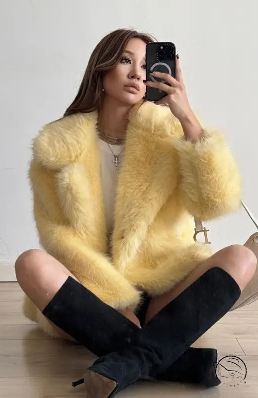 Yellow fluffy faux fur coat with black buttons and pockets by Langry fashion