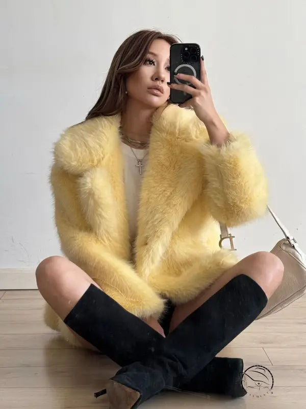 Yellow fluffy faux fur coat with black buttons and pockets by Langry fashion