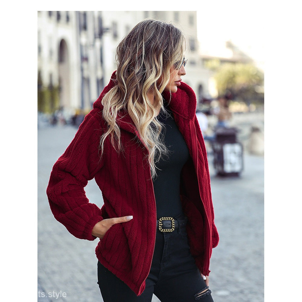 Gorgeous red hooded long sleeve jacket worn with distressed black jeans and decorative belt