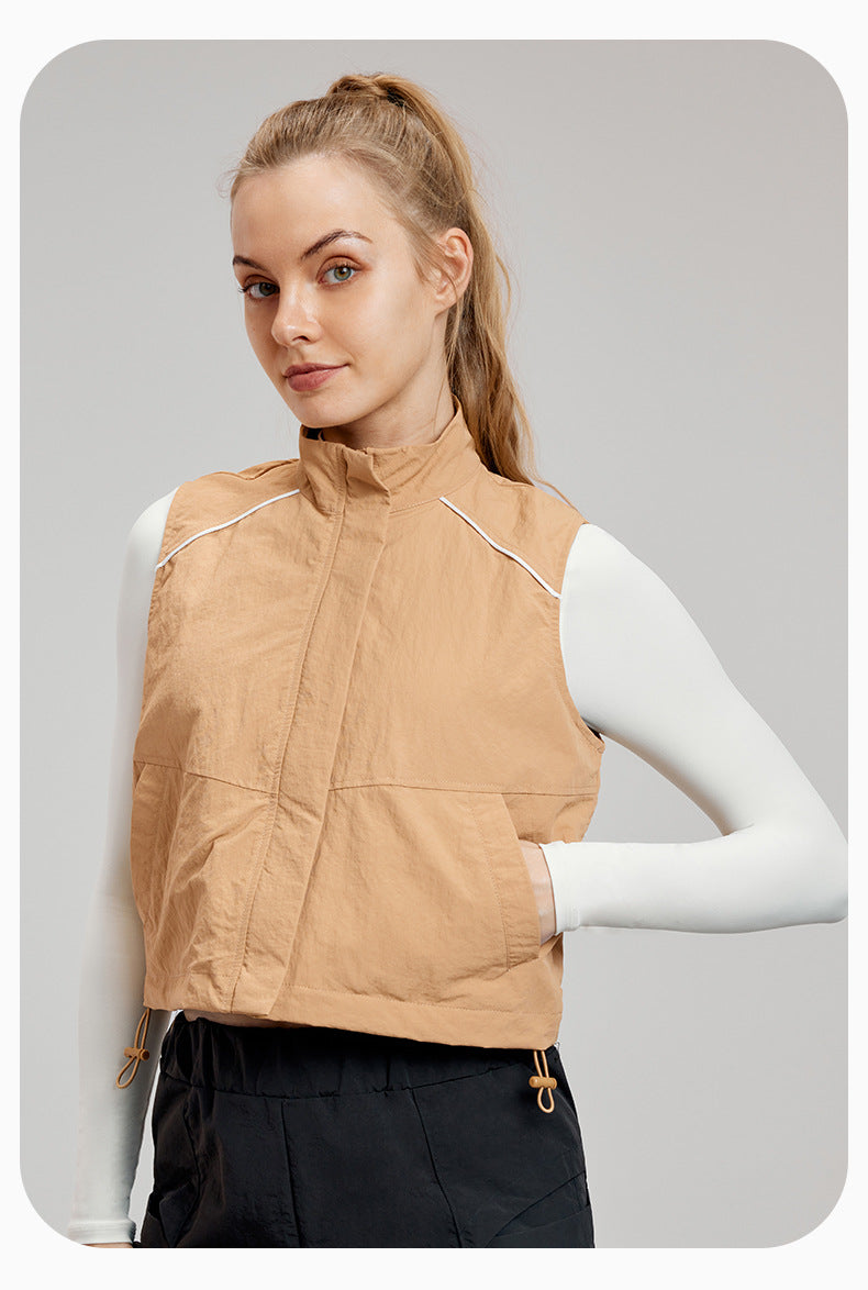 Tan puffer vest with white trim for stylish and comfortable sports fashion ملابس