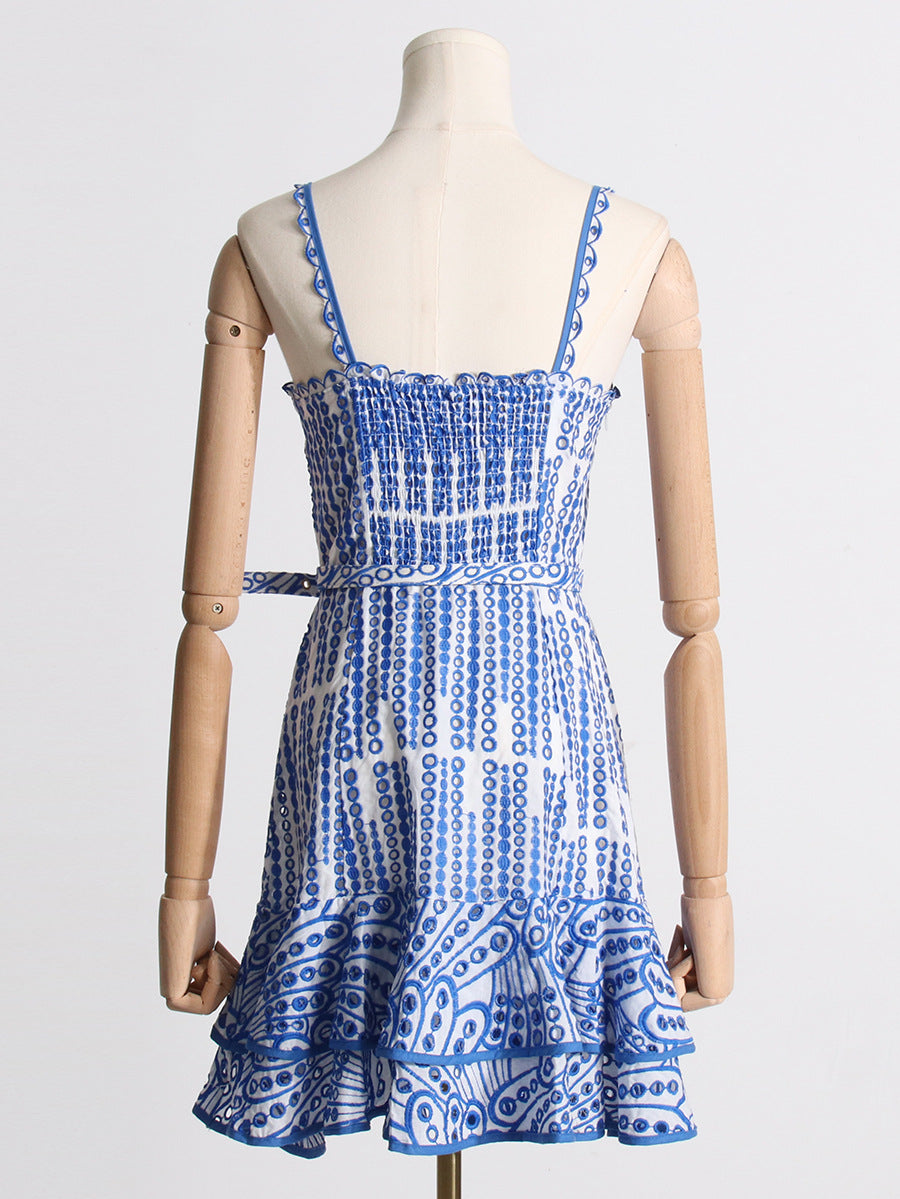 Blue and white patterned sundress with ruffles, ideal for summer fashion ملابس