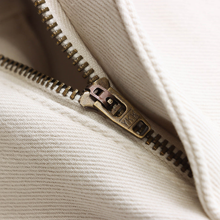 Metal zipper detail on white fabric of Street Design Wide Leg Jeans in fashion ملابس