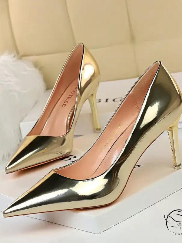 Pair of fashionable langry gold pointed-toe high heels