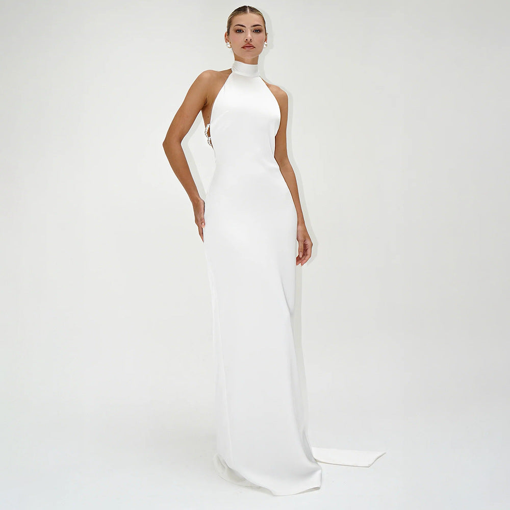 Elegant white halter-neck gown showcasing luxurious silk satin texture for stylish women fashion