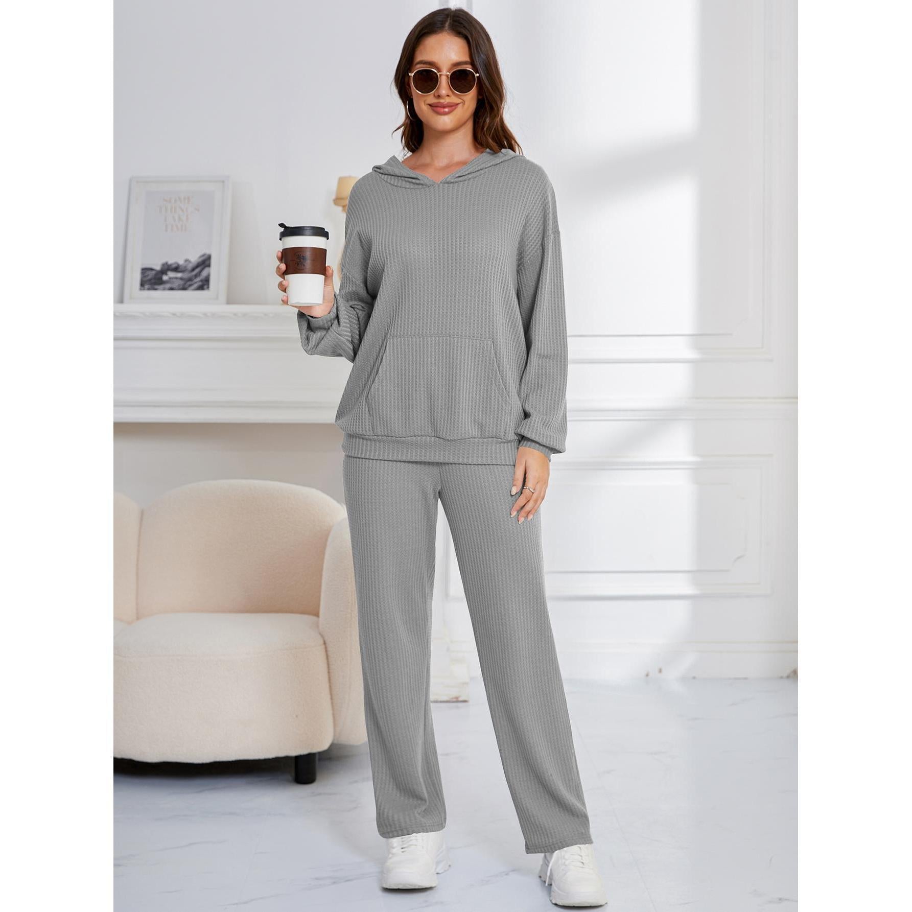 Woman in gray ribbed lounge set from Hooded Casual Suit for stylish home wear ملابس