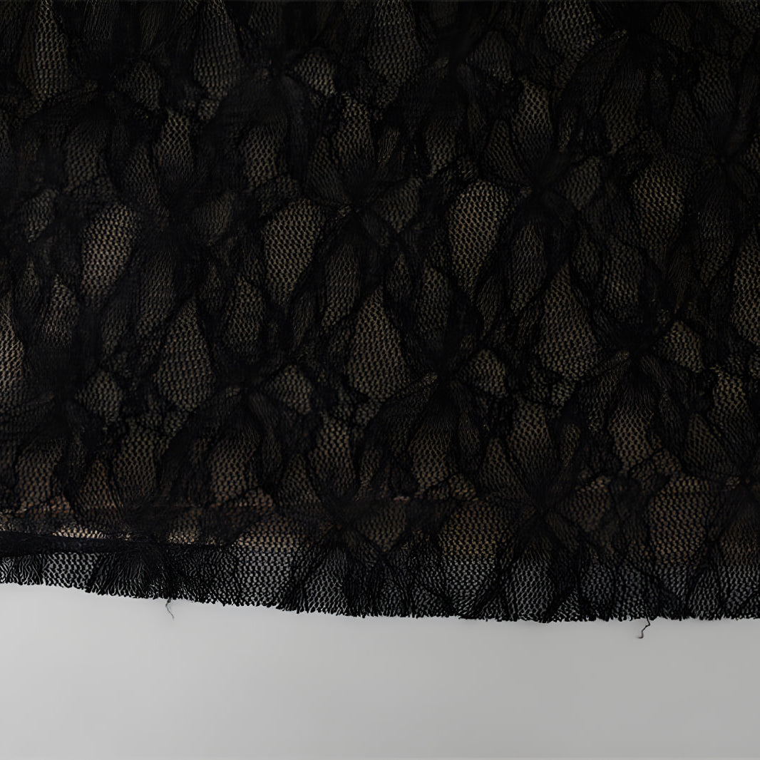Black lace fabric with floral pattern featured in Stunning Pure Lace Dress for elegant fashion