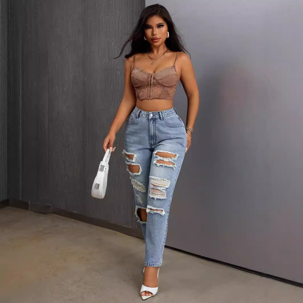 Light blue slimming skinny ripped jeans worn by a woman showcasing trendy fashion style