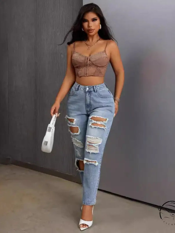 Slimming skinny ripped jeans in light blue on a woman