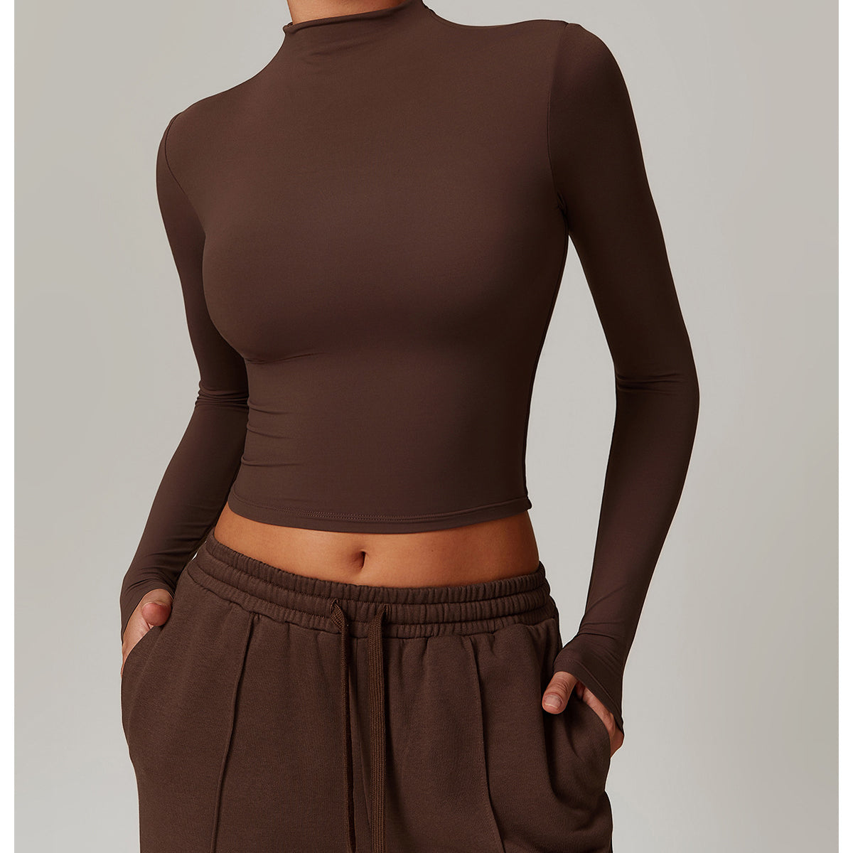 Brown long-sleeved crop top with mock neckline for stylish fitness sports outerwear