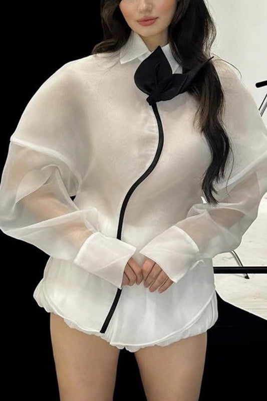 White sheer langry fashion blouse with black trim and ruffled hem