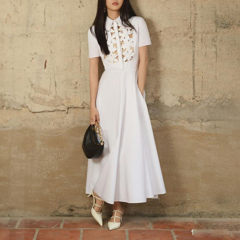 Elegant white collared midi dress showcasing fashionable ملابس for women with floral details