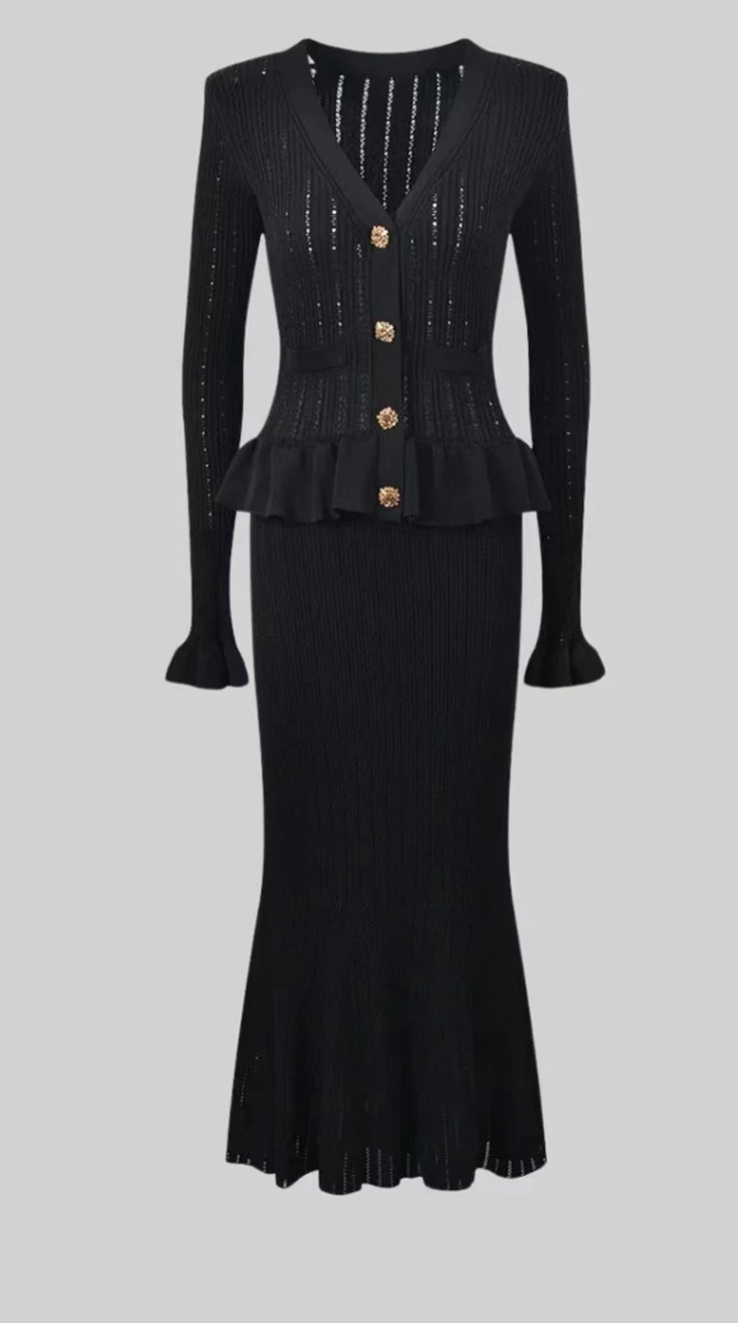 Elegant black knit cardigan dress and skirt set showcasing sophisticated fashion style
