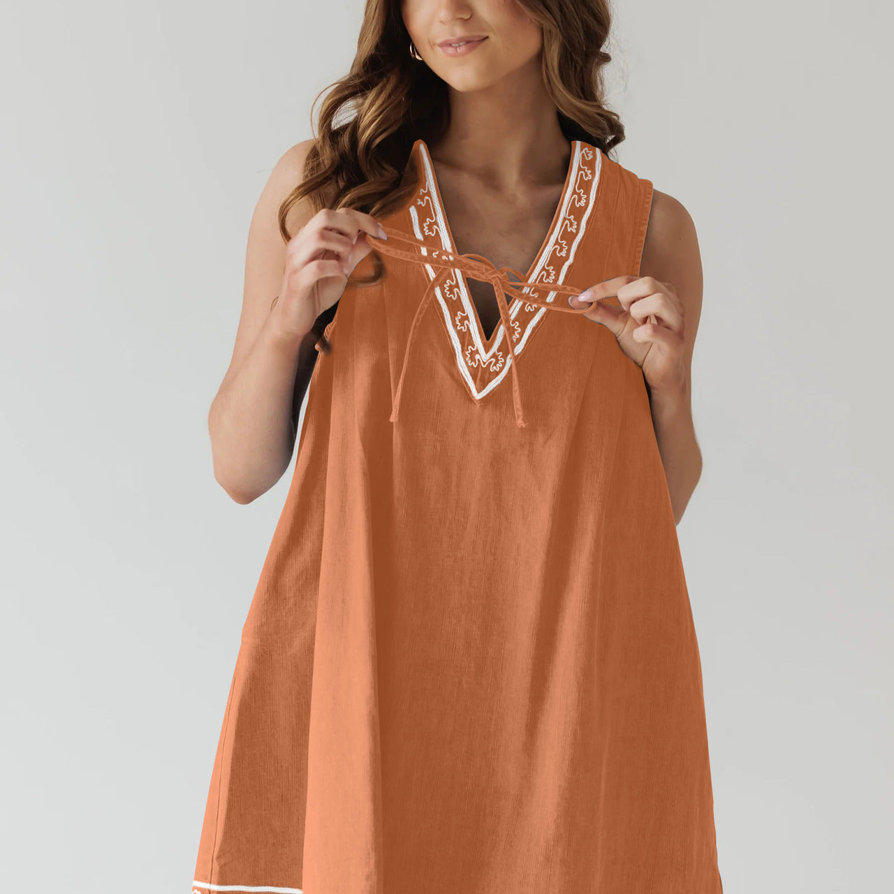 Orange sleeveless dress with white trim from Beautiful Embroidered Vest Denim Dress fashion