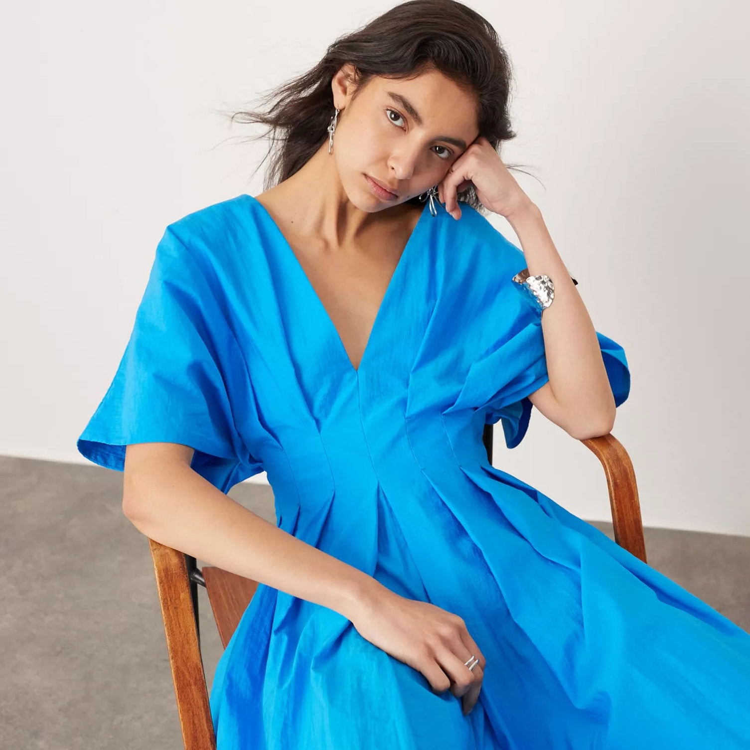 Langry blue silk wrap dress with ruffled sleeves and deep V-neckline