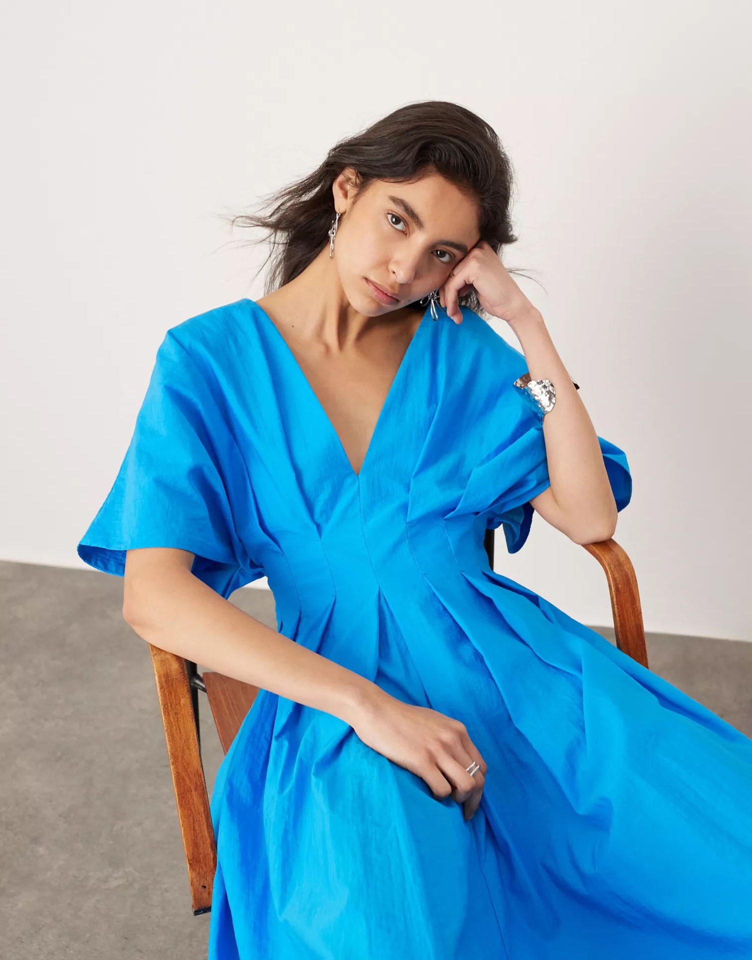 Langry blue silk wrap dress with ruffled sleeves and deep V-neckline