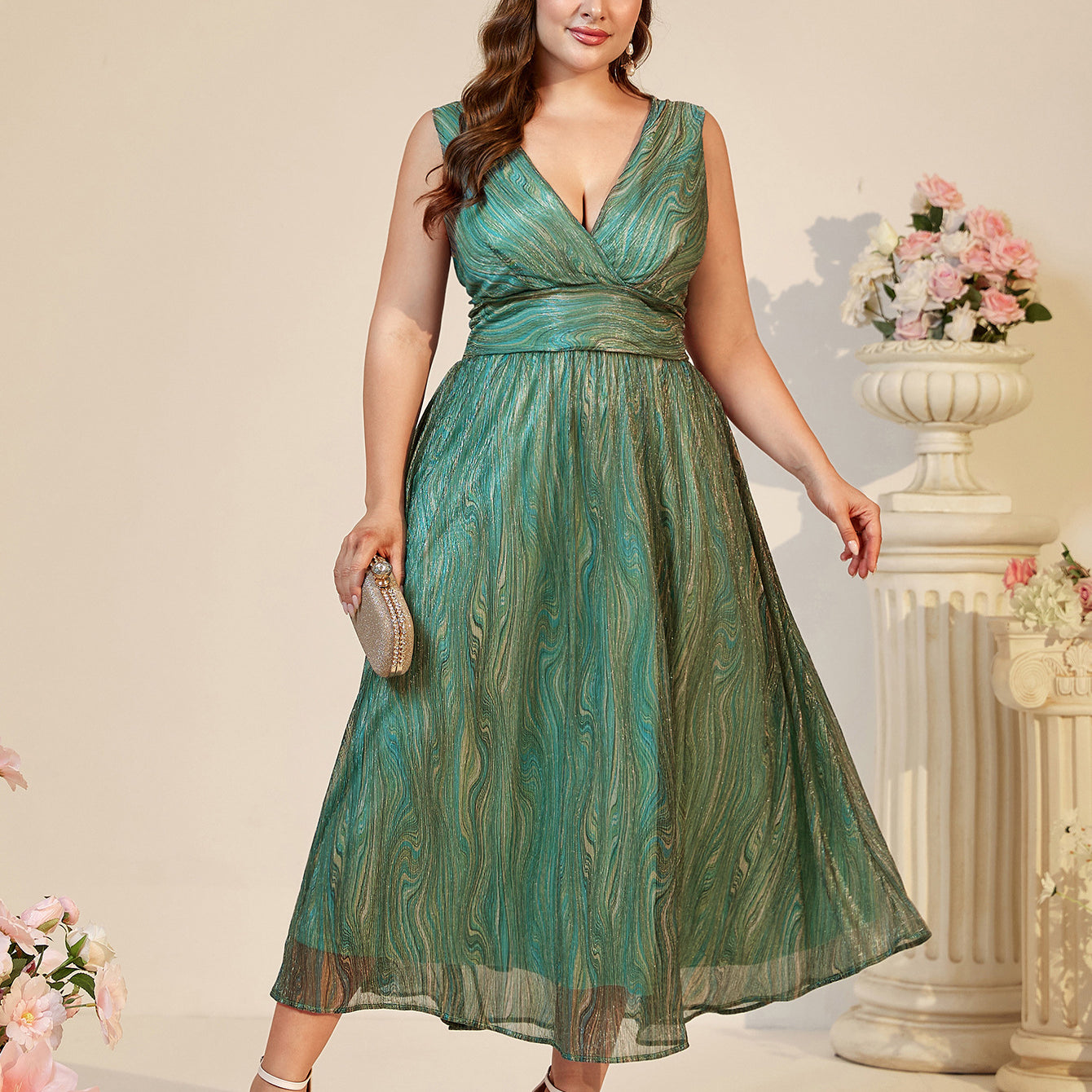 Beautiful suspender maxi dress in shimmering green fabric with abstract pattern