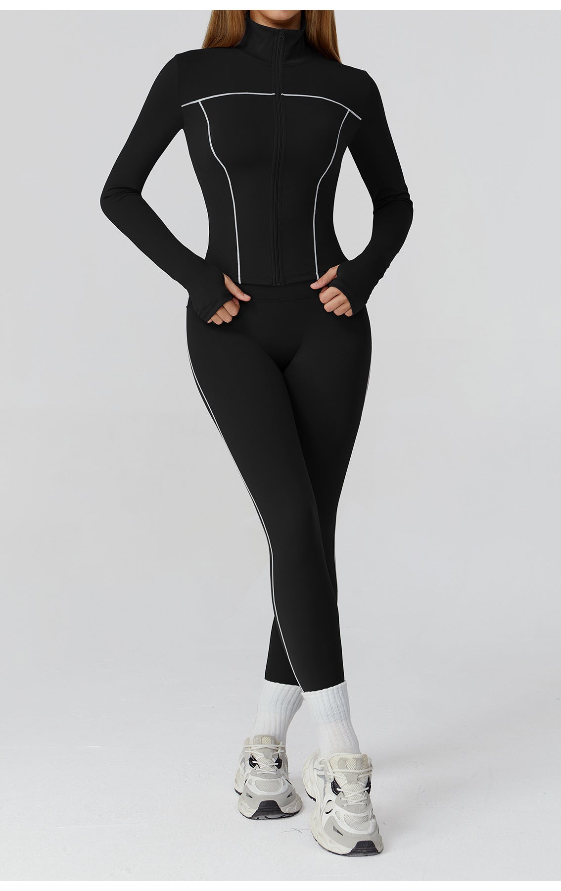 Langry black and white athletic jumpsuit with silver accents for fashion fitness