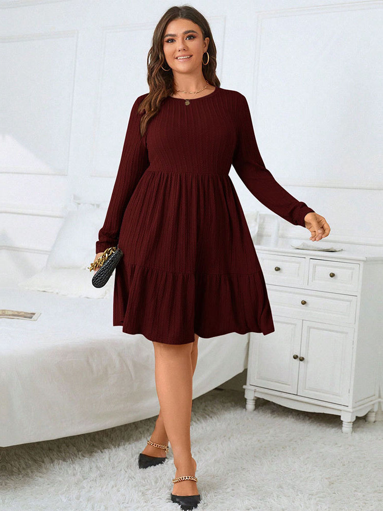 Elegant red midi dress featuring a woman in a long-sleeved tiered design and black heels