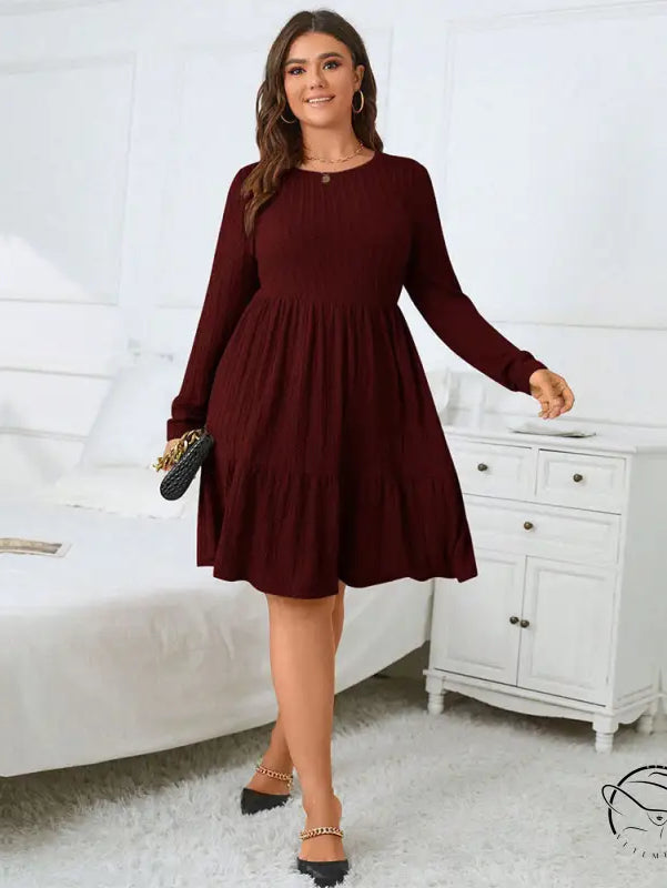 Elegant red midi dress: woman in maroon tiered gown and black heels