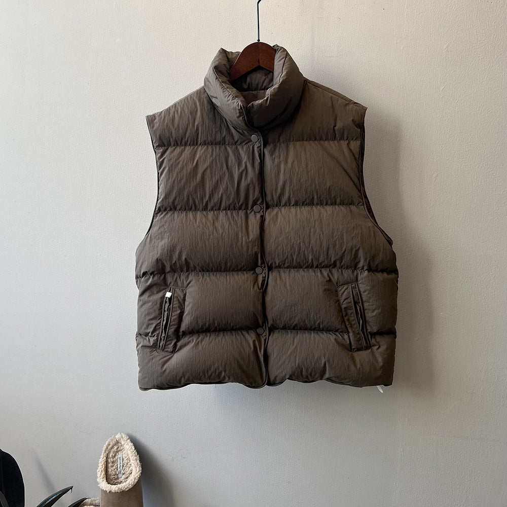 Brown puffy winter vest with zippered pockets for stylish and warm langry fashion ملابس