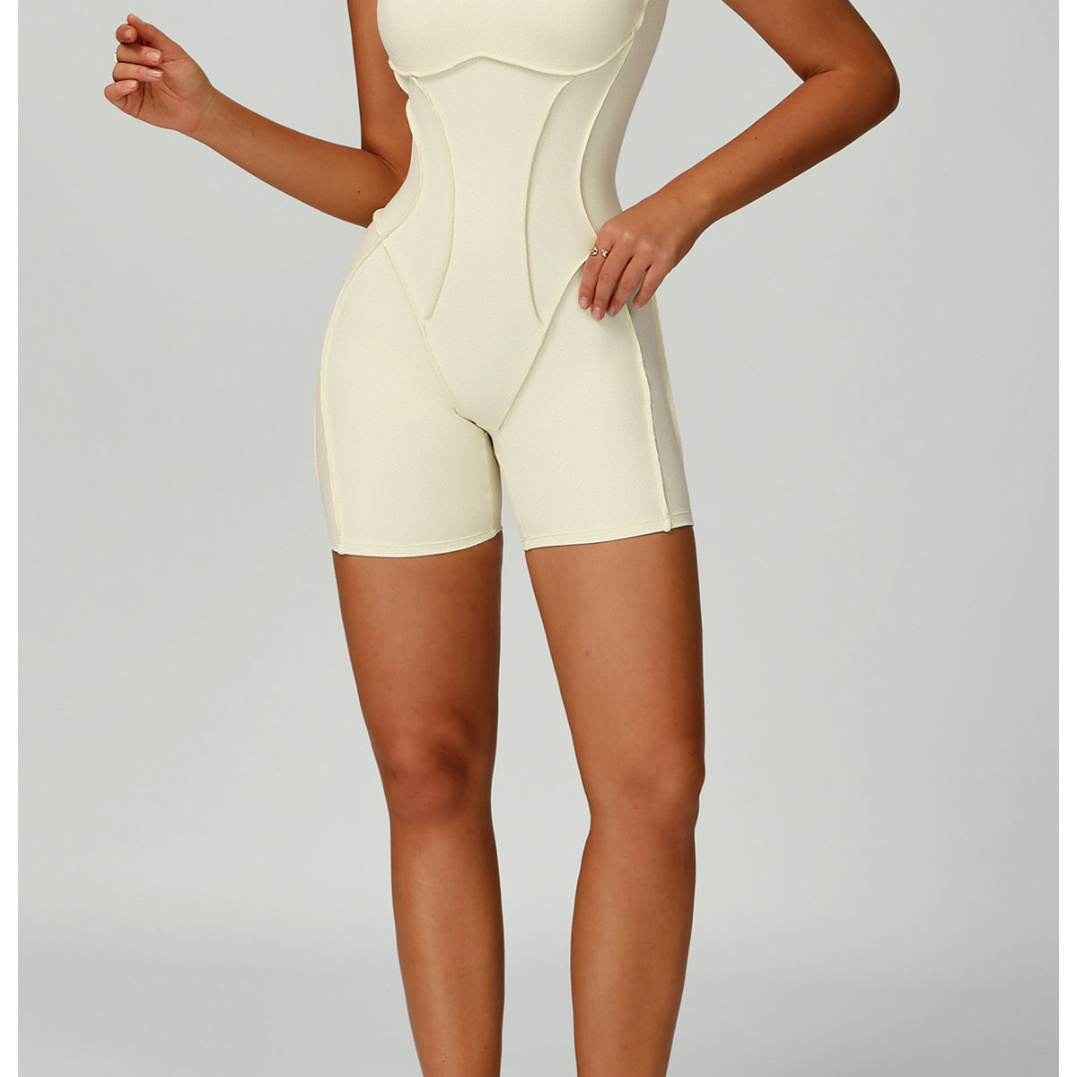 Langry fashion yoga jumpsuit with white form-fitting cutout design and sneakers