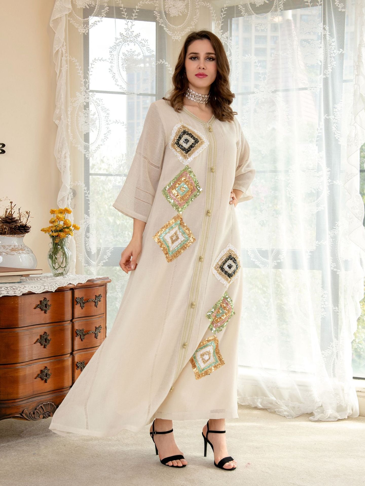 White embroidered maxi dress in Langry fashion with geometric patterns and lace trim