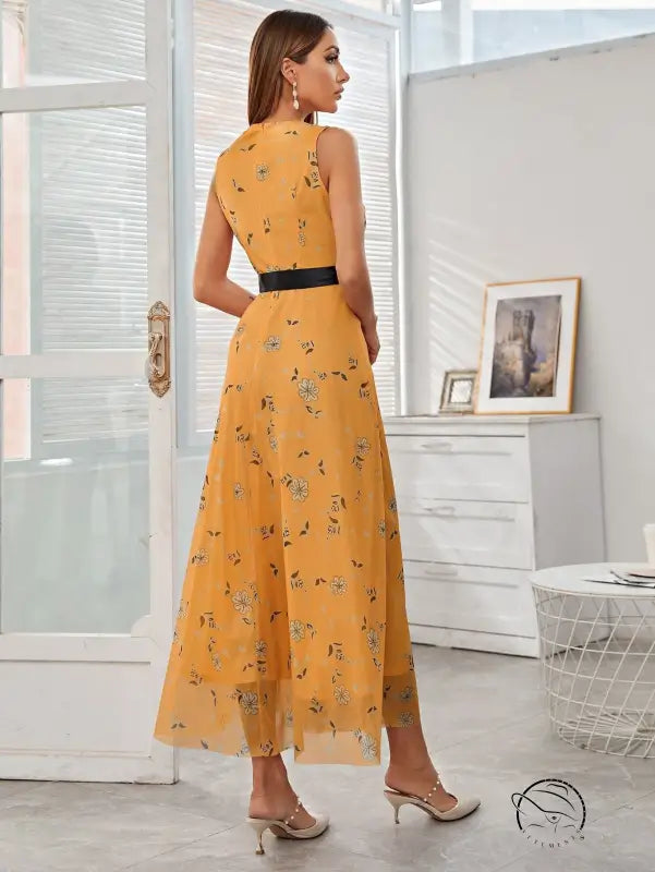Elegant yellow floral maxi langry dress with black waist belt in fashion style