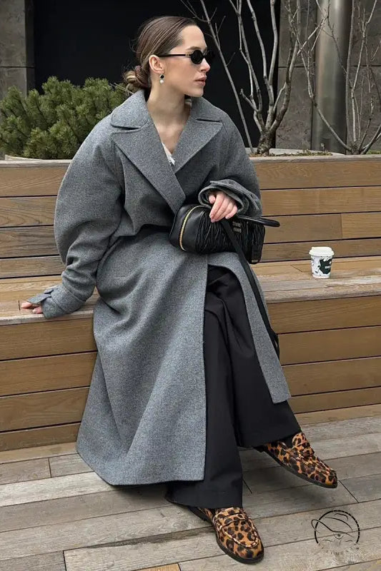 Black quilted handbag with gold-tone hardware from Langry fashion winter lace up baggy woolen coat