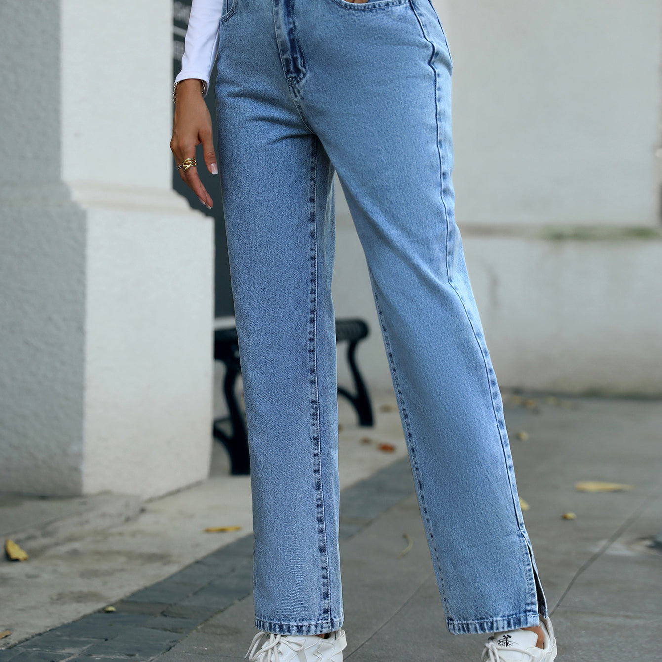 Light-wash straight-leg trendy denim trousers with side slits for a stylish look
