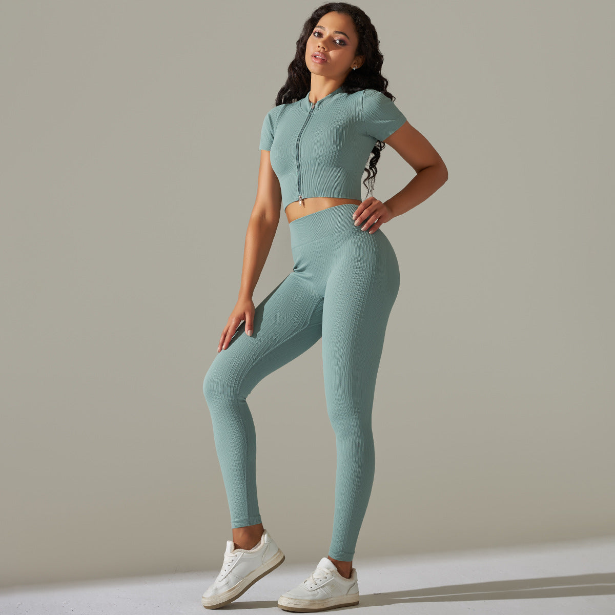 Woman in seamless knitted peach hip high waist yoga set for active wear