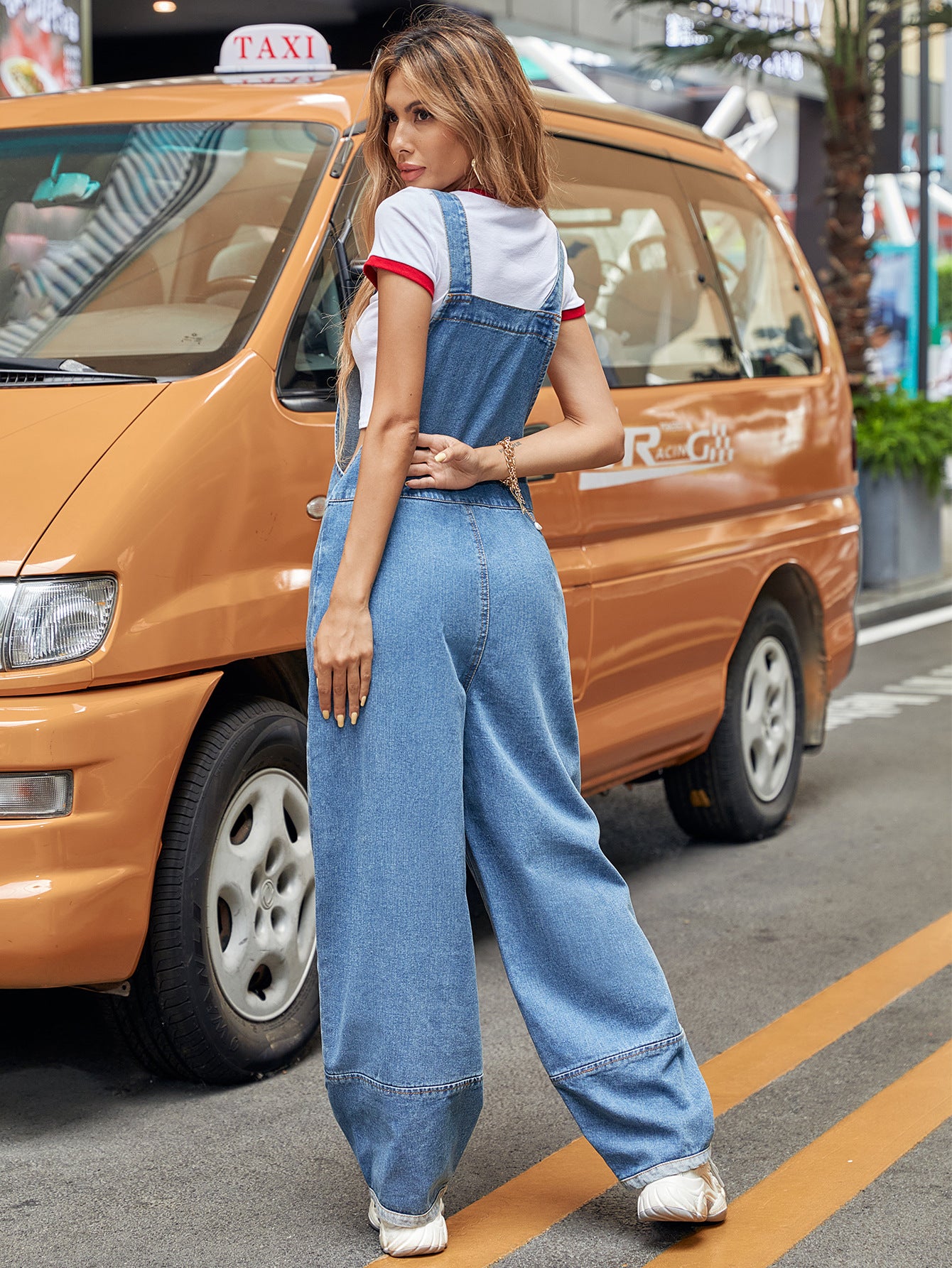 Casual denim jumpsuit featuring stylish wide-leg overalls for fashionable women