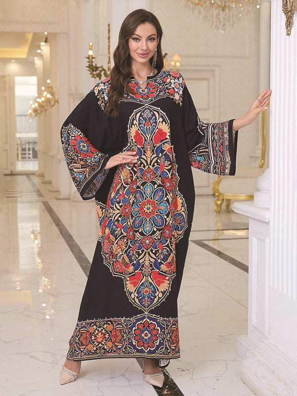 Elegant loose black kaftan dress with colorful floral pattern and bell sleeves