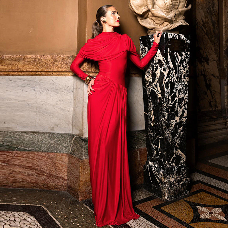 Elegant floor-length red gown with ruched detailing, perfect for sophisticated fashion