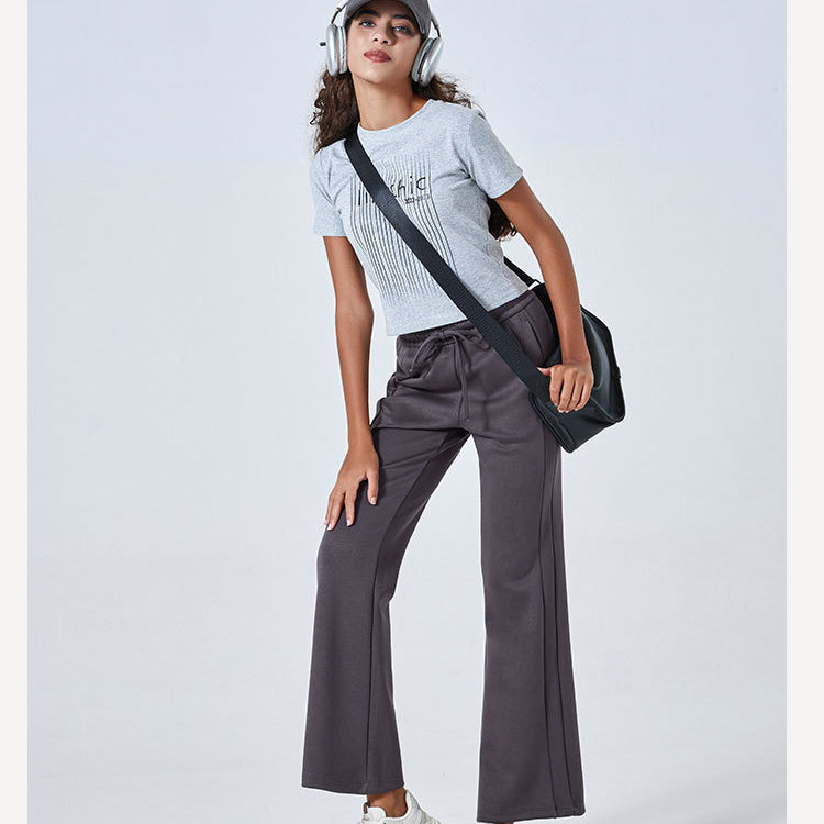 Person in gray t-shirt and wide-leg pants showcasing Summer Air Layer Pure Cotton fashion ملابس