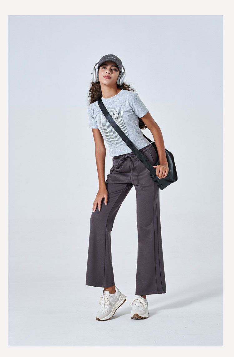 Person in gray t-shirt and wide-leg pants showcasing Summer Air Layer Pure Cotton fashion ملابس