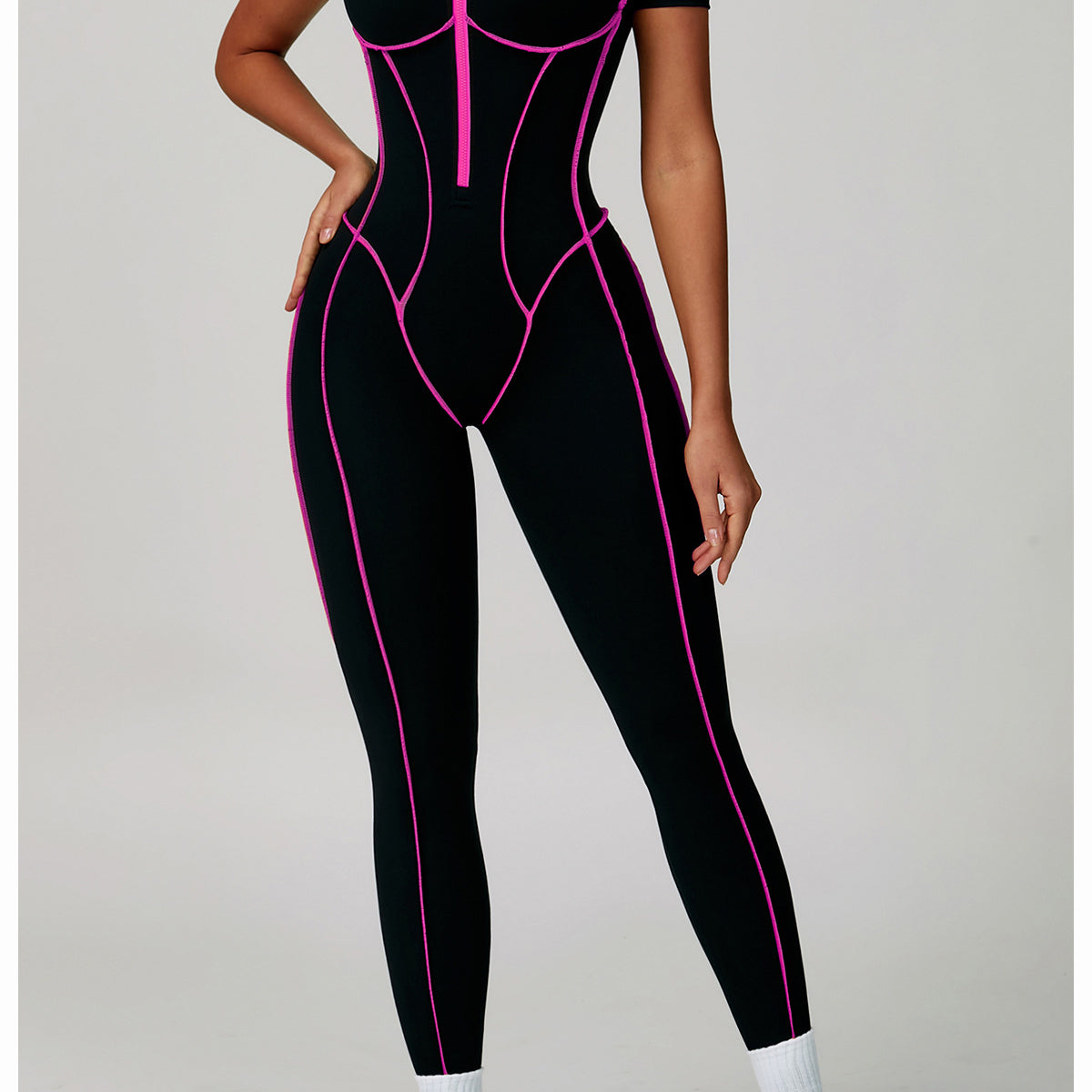 Black and pink spiderweb Langry fashion jumpsuit with white sneakers