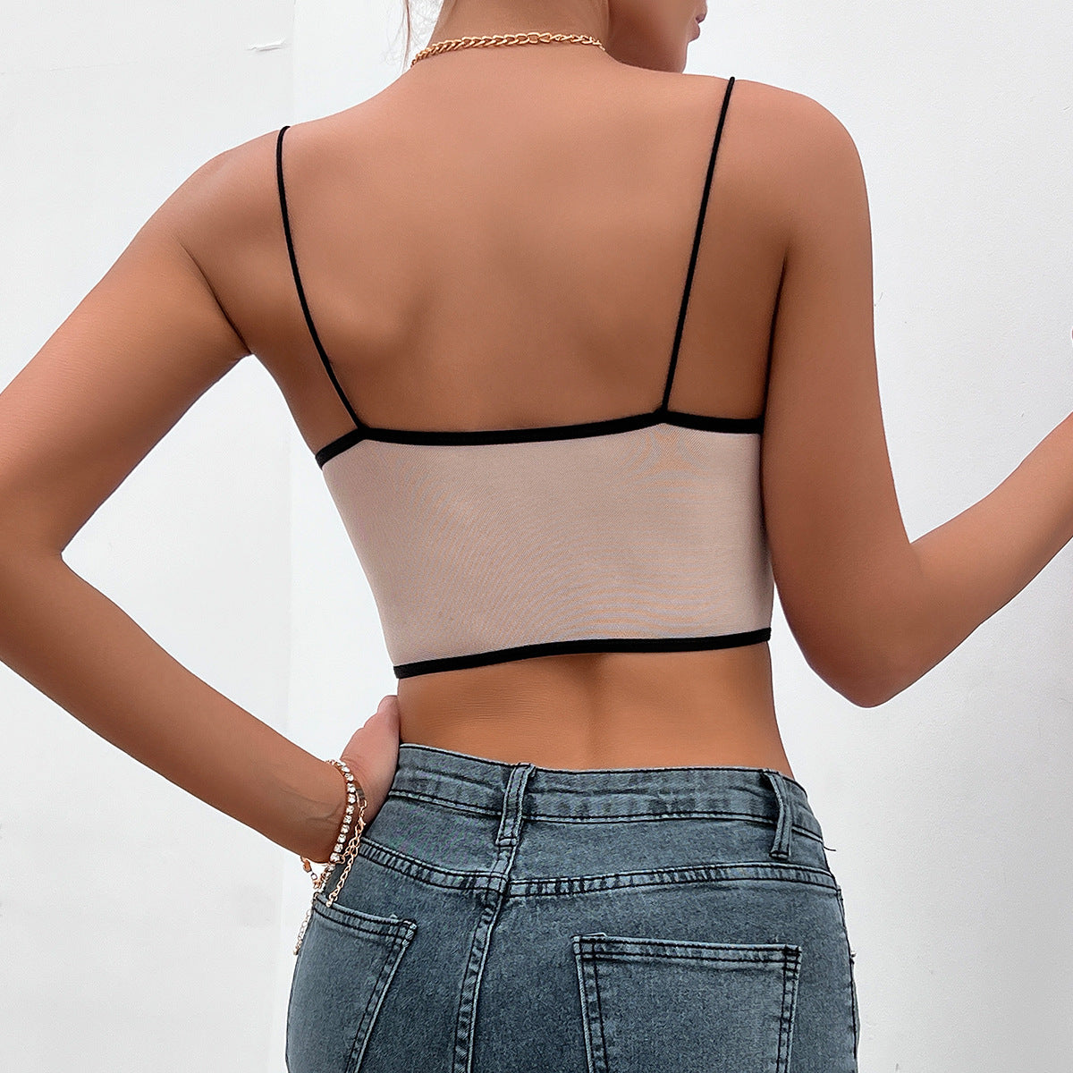 Woman’s Deep V Plunge Lace Party Backless Diamond Vest paired with jeans for trendy fashion