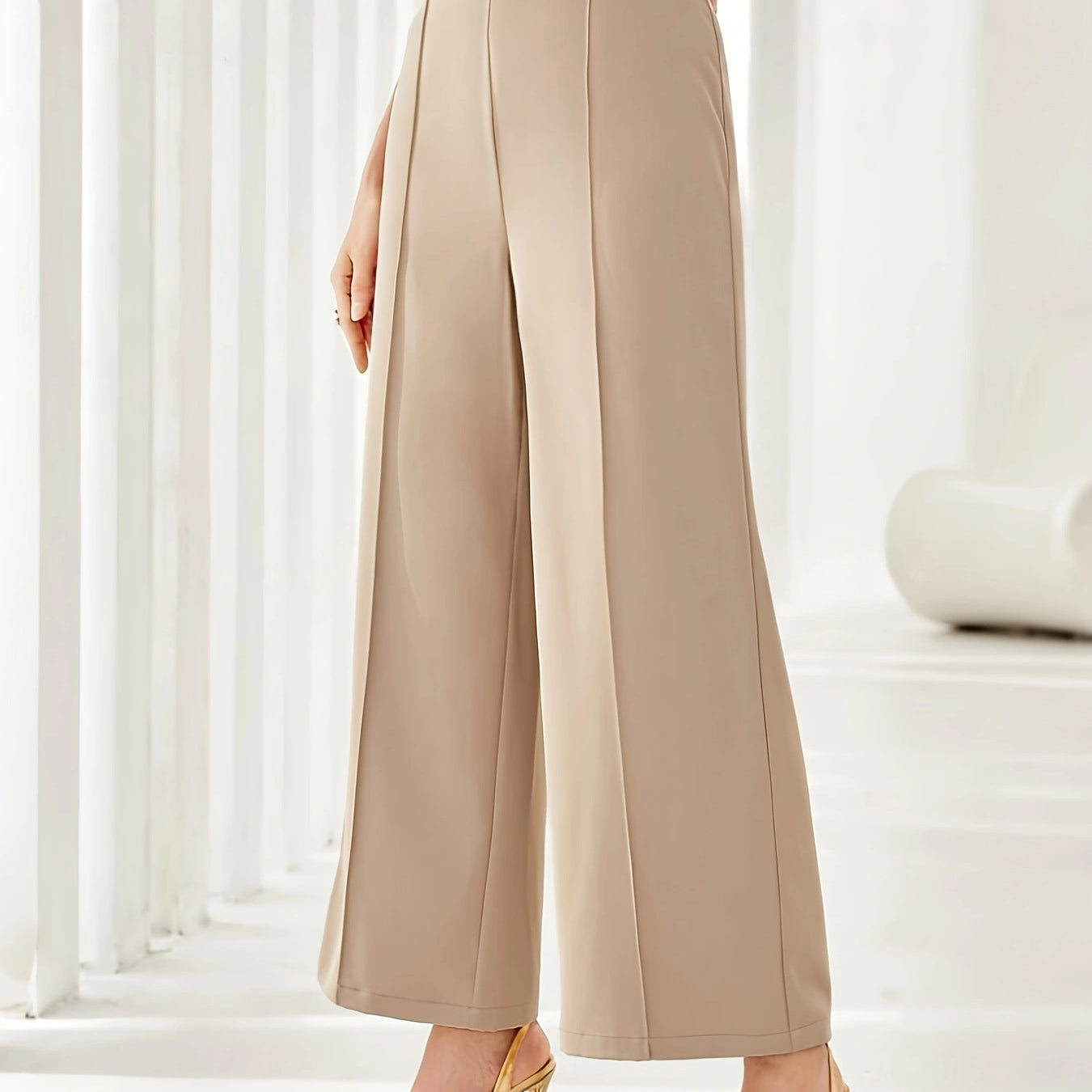 Beige wide leg cropped dress pants styled with strappy tan heels for elegant fashion