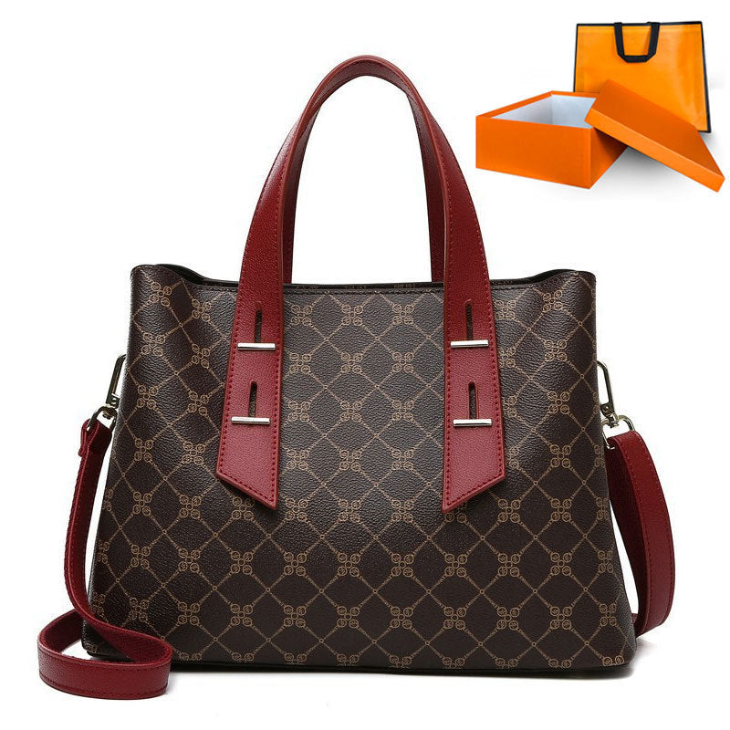 Langry brown and red monogrammed soft leather handbag with fashion accents