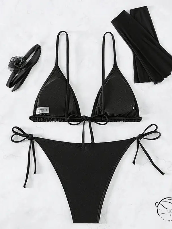 Black four piece set swimwear with string bikini, arm sleeves, headband