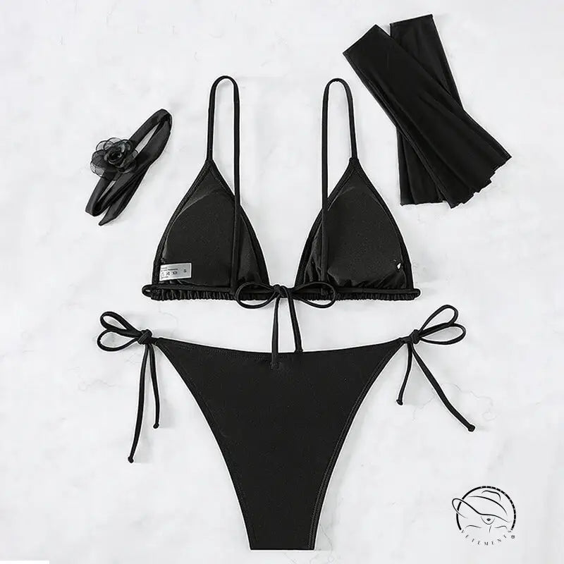 Black four piece set swimwear with string bikini, arm sleeves, headband