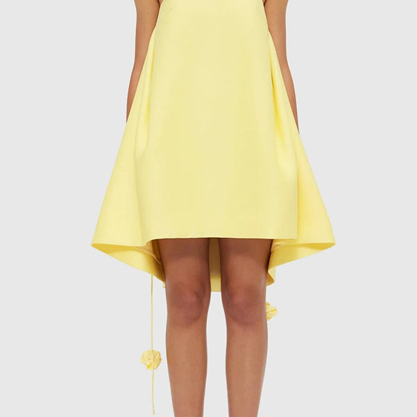Yellow high-low dress with floral straps, perfect for casual vacation fashion in ملابس