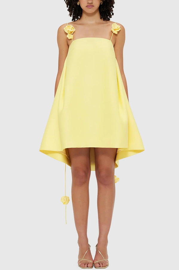 Yellow high-low dress with floral straps, perfect for casual vacation fashion in ملابس