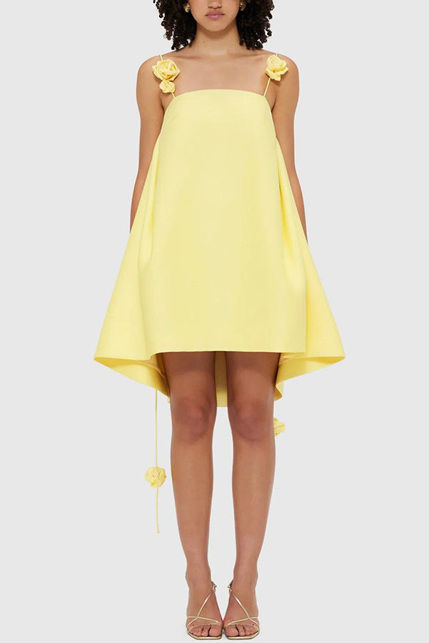 Yellow high-low dress with floral straps, perfect for casual vacation fashion in ملابس