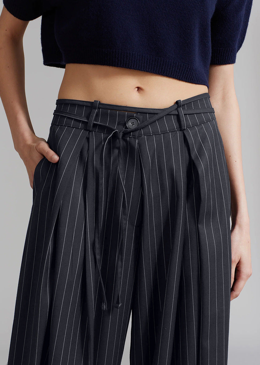 Black pinstripe loose drooping casual work pant with drawstring waist for comfortable style