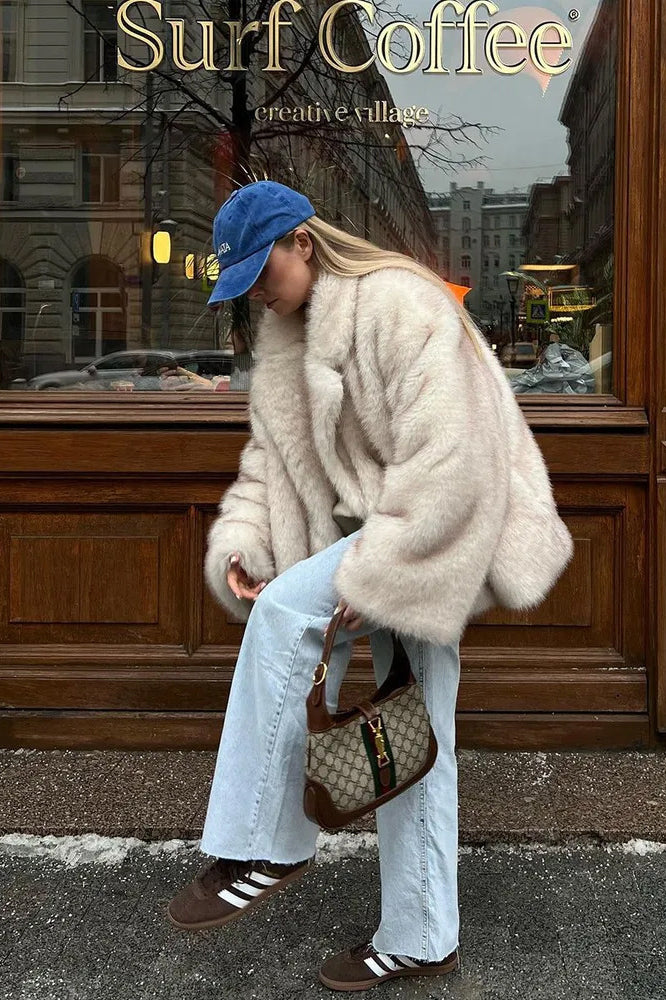Fashionable faux fur coat with beige Gucci shoulder bag