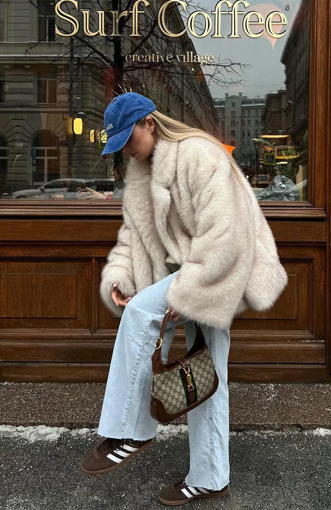 Fashionable faux fur coat with beige Gucci shoulder bag